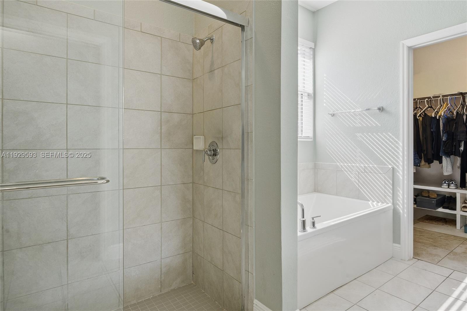 27641 Southwest 134th Court Homestead, FL 33033 - Photo 23 of 40 a bathroom with a bathtub