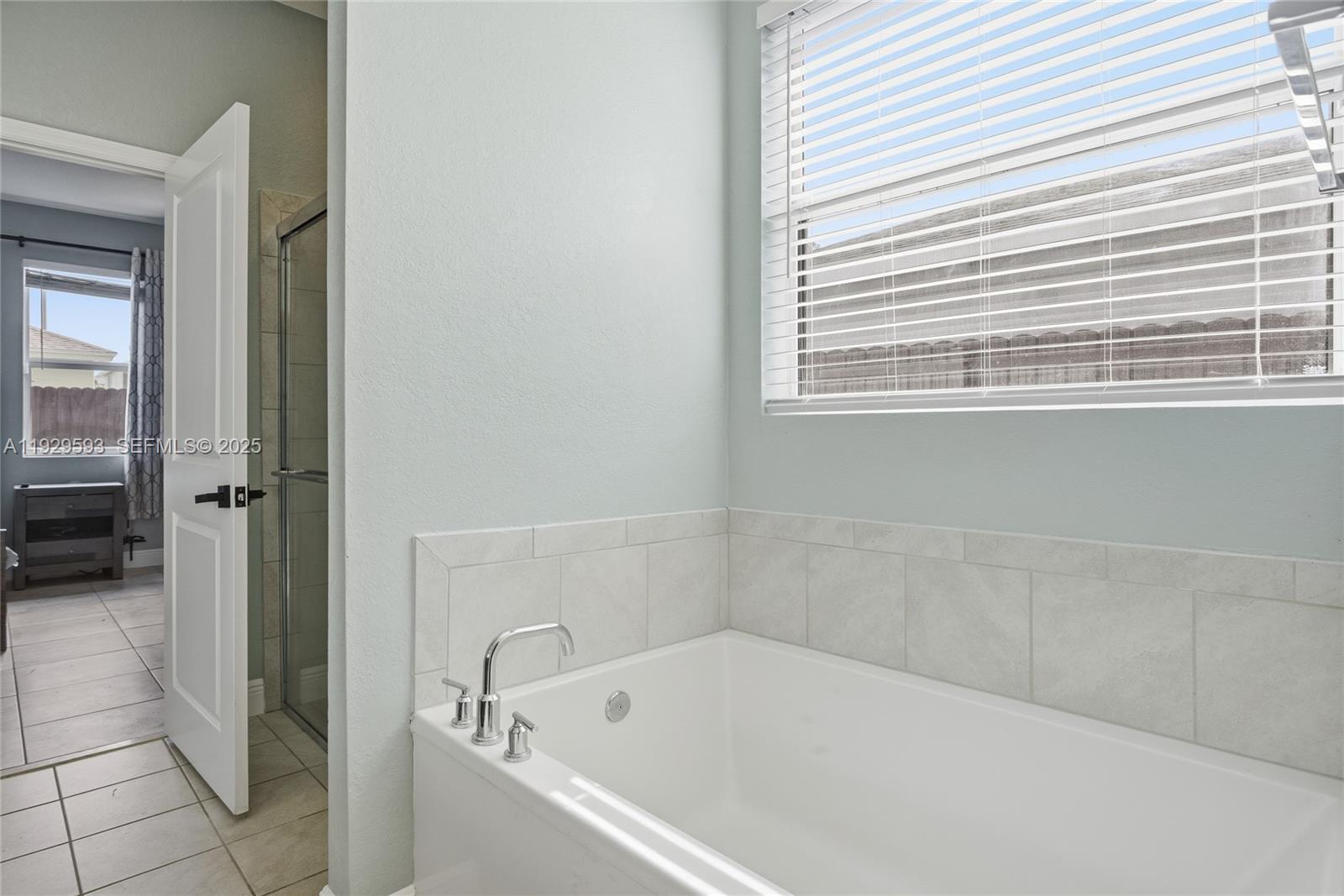 27641 Southwest 134th Court Homestead, FL 33033 - Photo 25 of 40 a white bath tub sitting next to a window