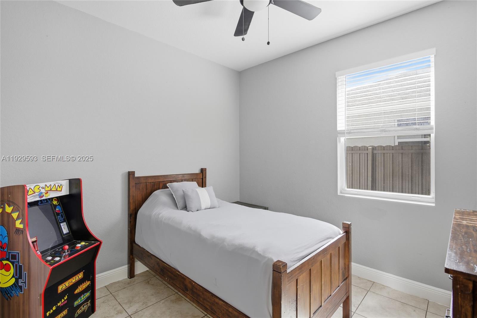 27641 Southwest 134th Court Homestead, FL 33033 - Photo 26 of 40 a bedroom with a bed and wooden floor