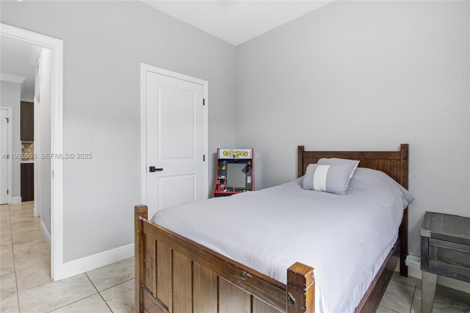27641 Southwest 134th Court Homestead, FL 33033 - Photo 27 of 40 a bedroom with a bed and a cabinets