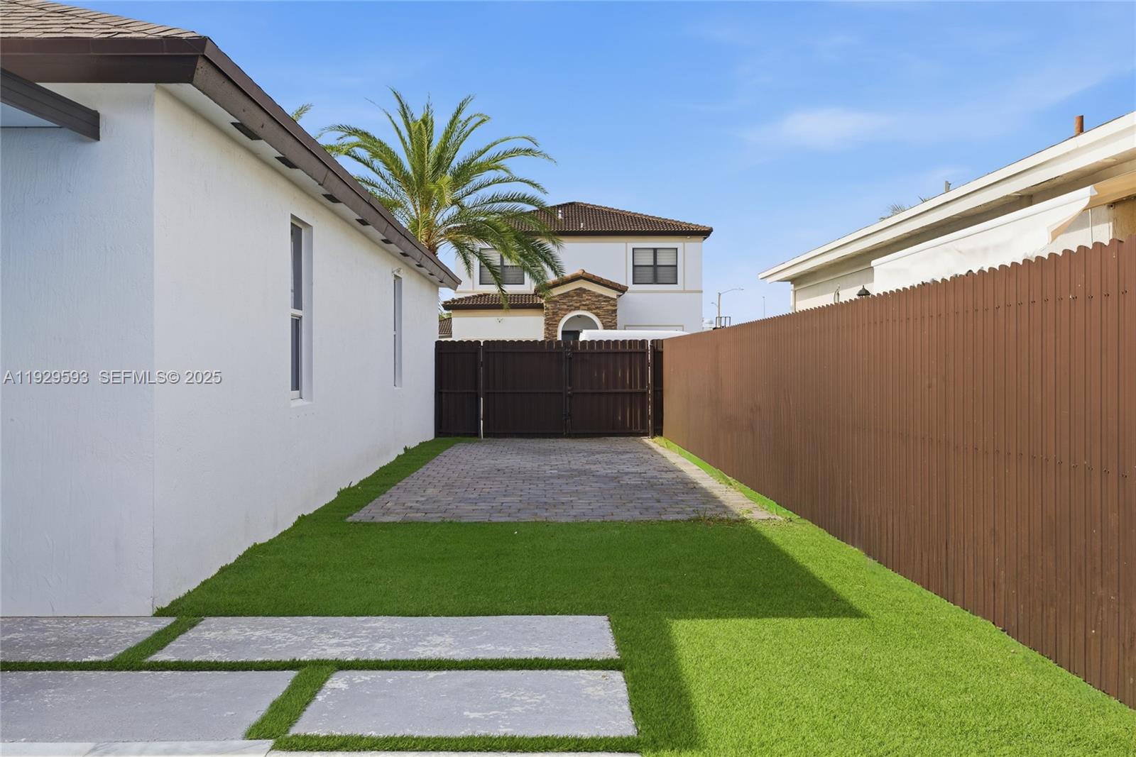 27641 Southwest 134th Court Homestead, FL 33033 - Photo 3 of 40 a house view with a garden space