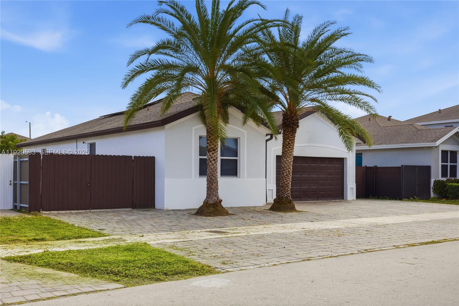 27641 Southwest 134th Court Homestead, FL 33033 - Photo 4 of 40 a house with a palm tree