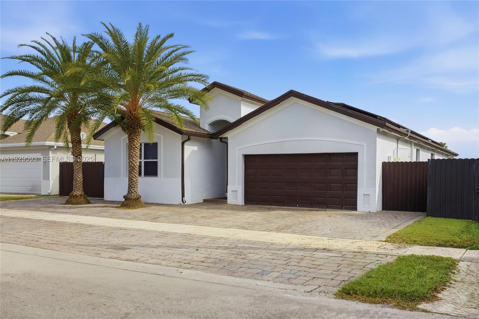 27641 Southwest 134th Court Homestead, FL 33033 - Photo 5 of 40 a view of a house with a yard and garage