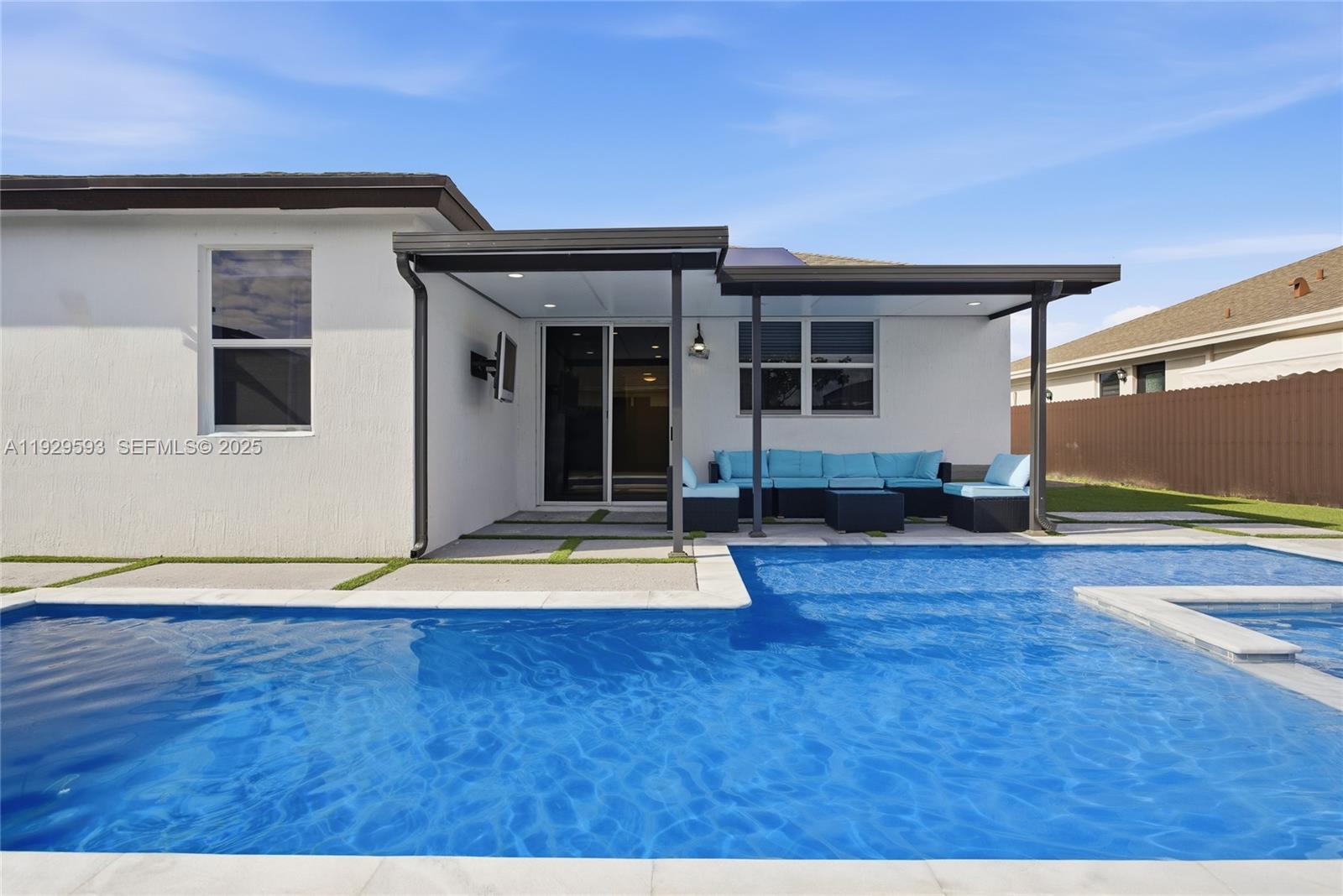 27641 Southwest 134th Court Homestead, FL 33033 - Photo 8 of 40 a house view with a garden space