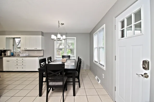 a view of a dining room with furniture window and outside view
