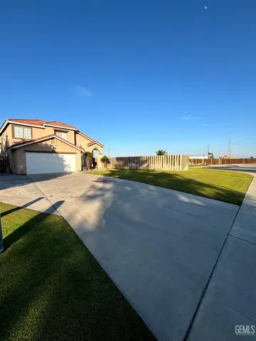 a view of a swimming pool and an outdoor seating