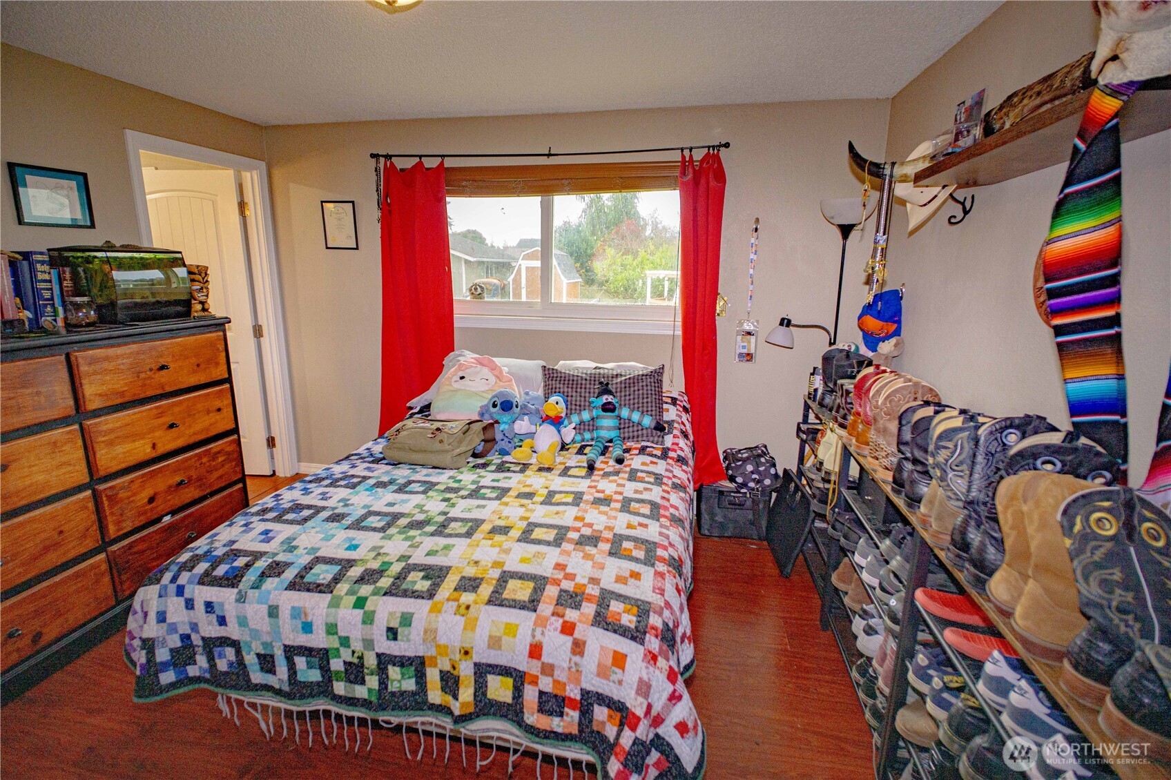 151 Valley View Drive Sequim, WA 98382 - Photo 24 of 40 a bedroom with a bed and a window