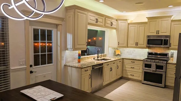 a kitchen with a stove and a sink