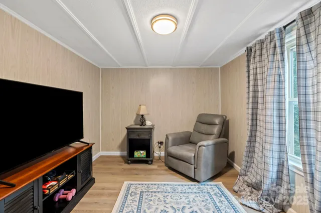 a bedroom with furniture and a rug