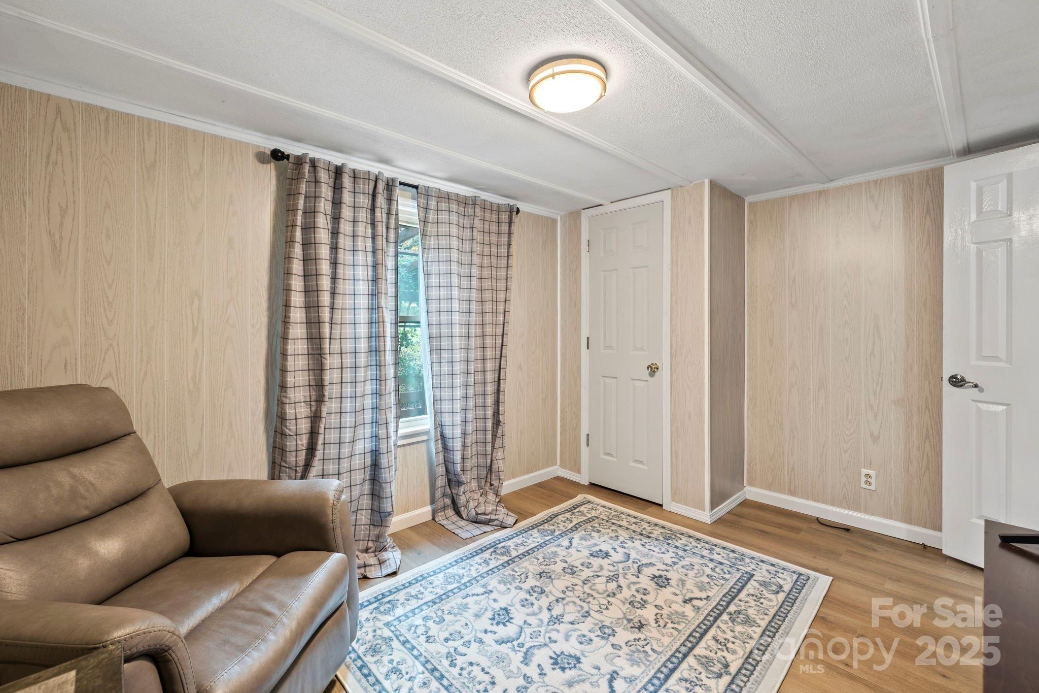 12 Timbers Edge Lane Fairview, NC 28730 - Photo 12 of 35 a bedroom with furniture and a rug