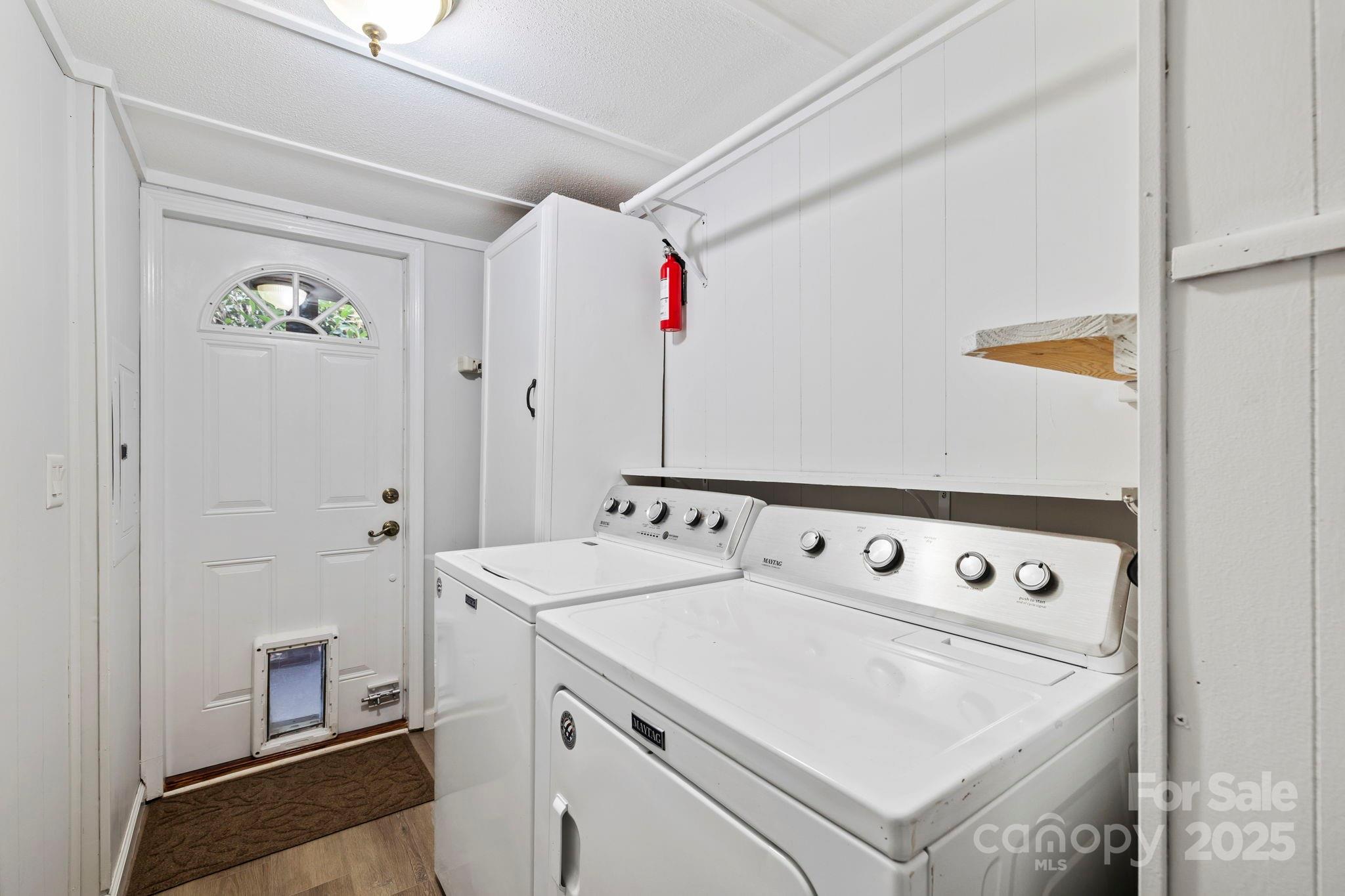 12 Timbers Edge Lane Fairview, NC 28730 - Photo 16 of 35 a utility room with dryer and washer