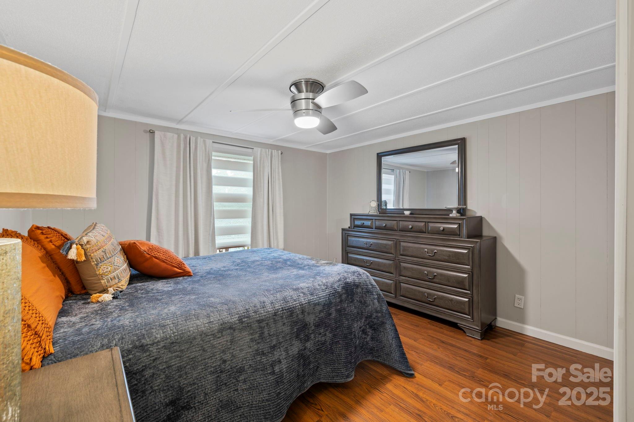 12 Timbers Edge Lane Fairview, NC 28730 - Photo 17 of 35 a bedroom with a bed and wooden floor