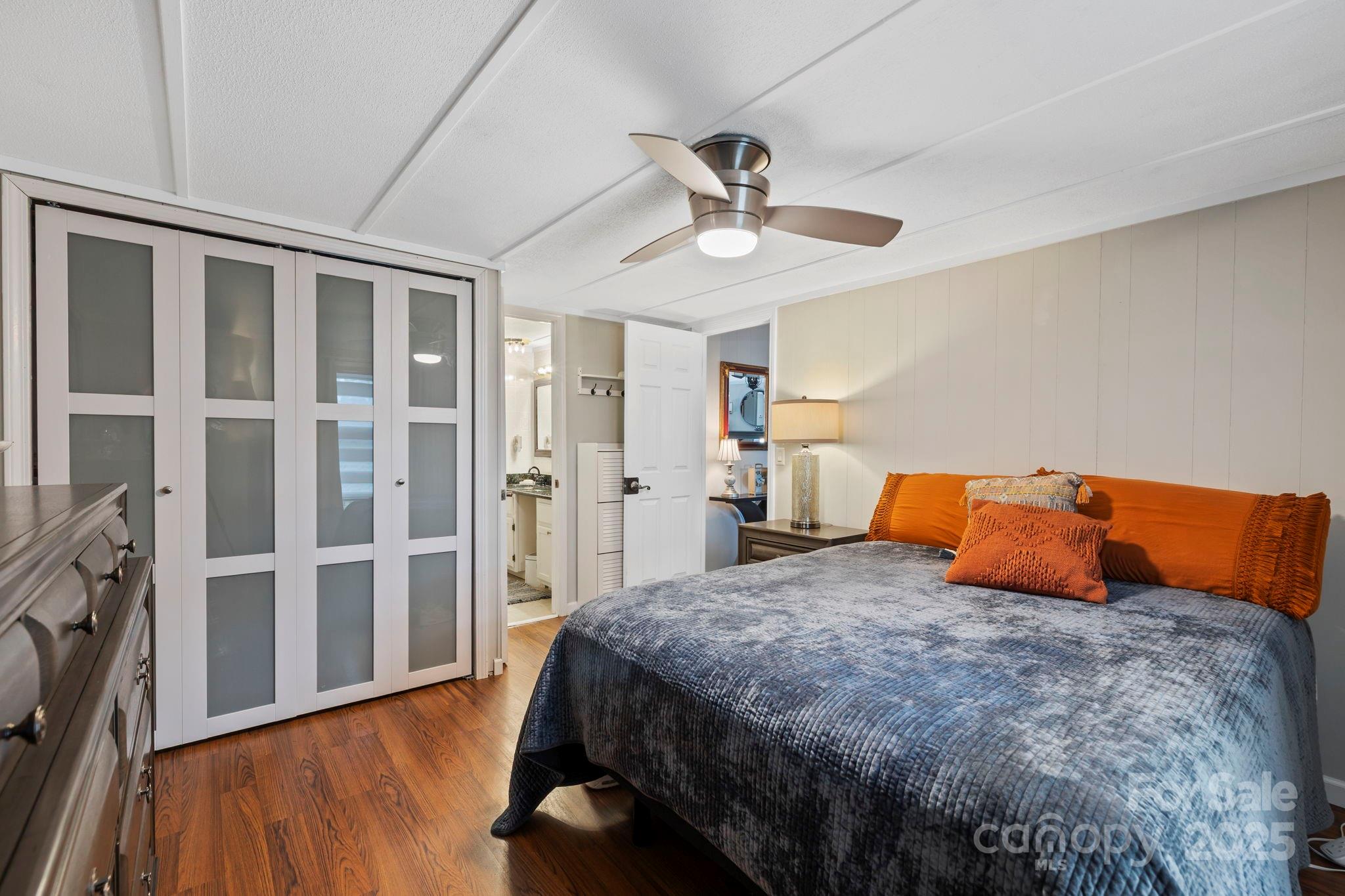 12 Timbers Edge Lane Fairview, NC 28730 - Photo 18 of 35 a bedroom with bed and wooden floor