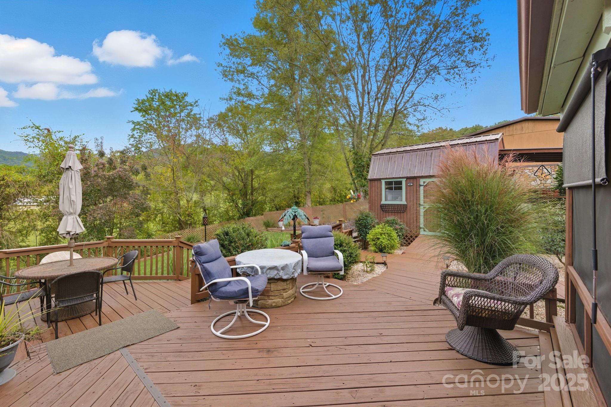 12 Timbers Edge Lane Fairview, NC 28730 - Photo 25 of 35 a view of a patio with couches chairs and a potted plant