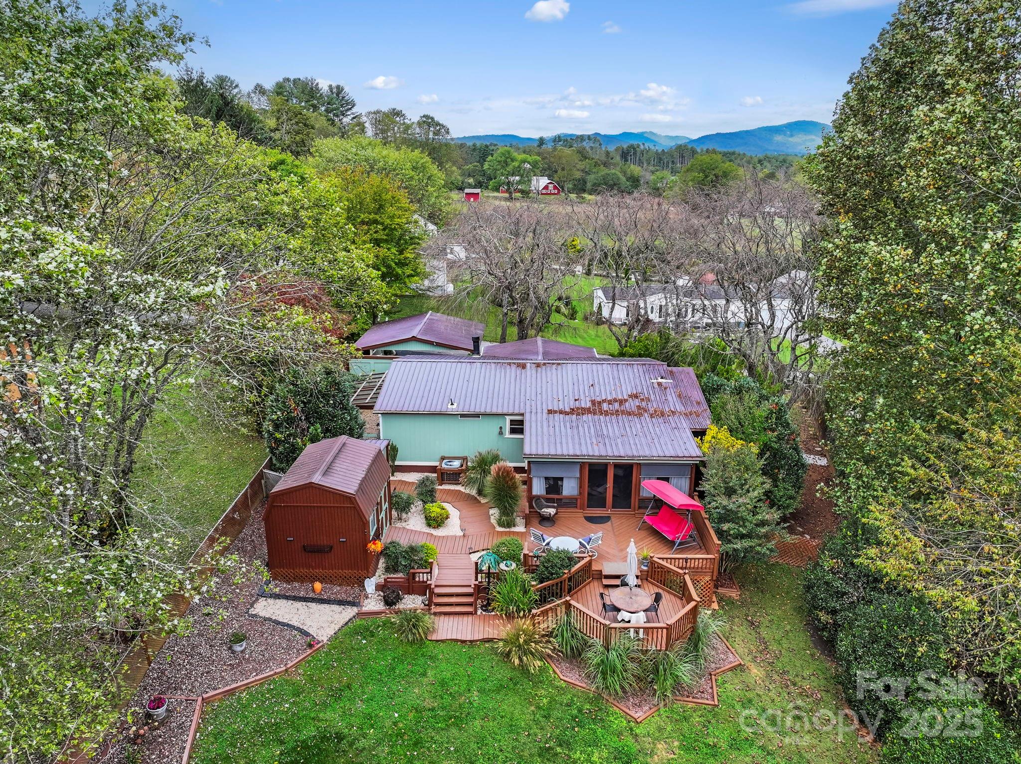 12 Timbers Edge Lane Fairview, NC 28730 - Photo 27 of 35 an aerial view of a house with swimming pool and garden