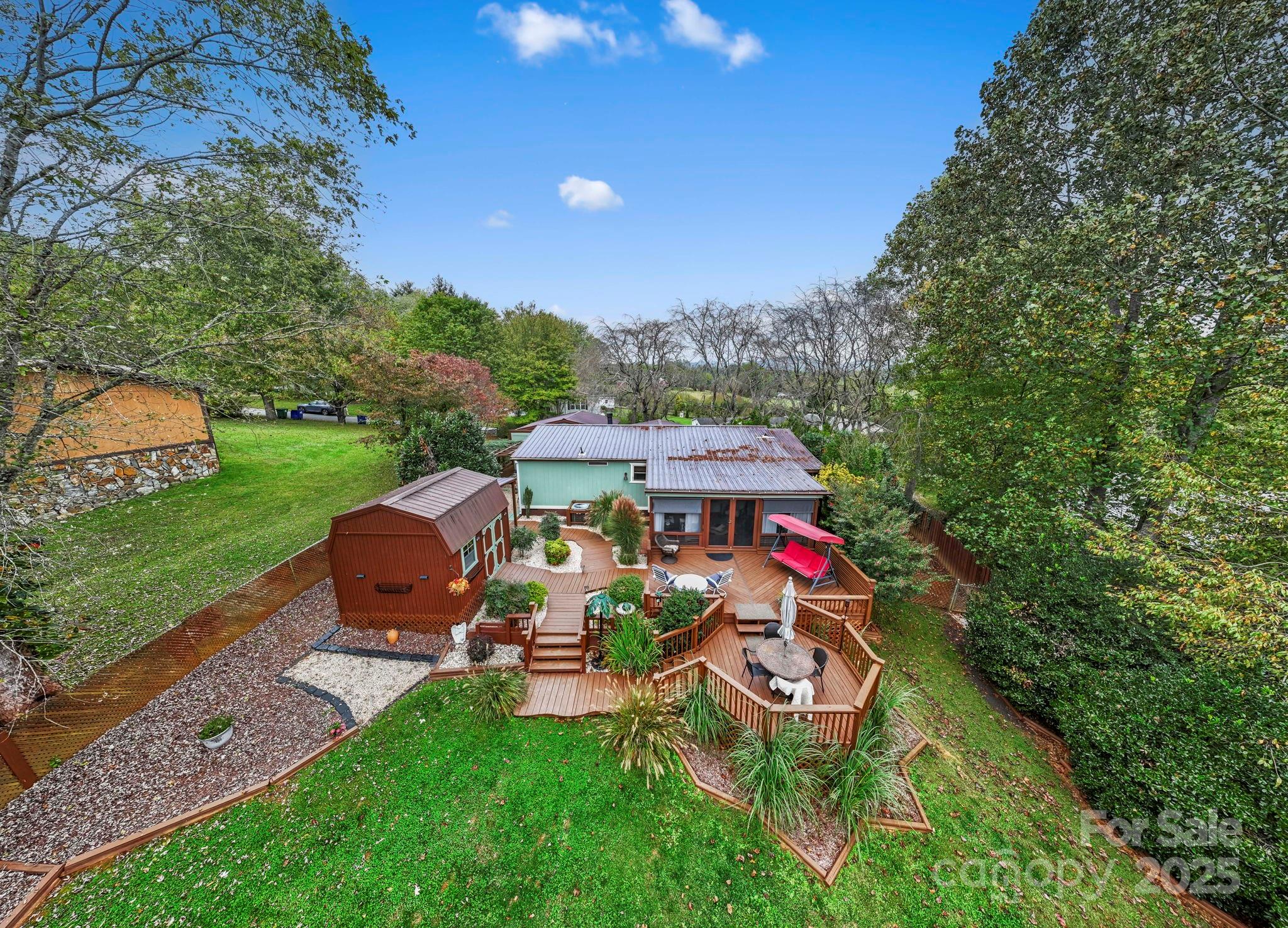 12 Timbers Edge Lane Fairview, NC 28730 - Photo 28 of 35 a view of a chairs and table in the garden