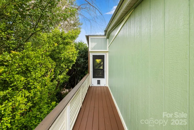 a view of balcony with wooden floor