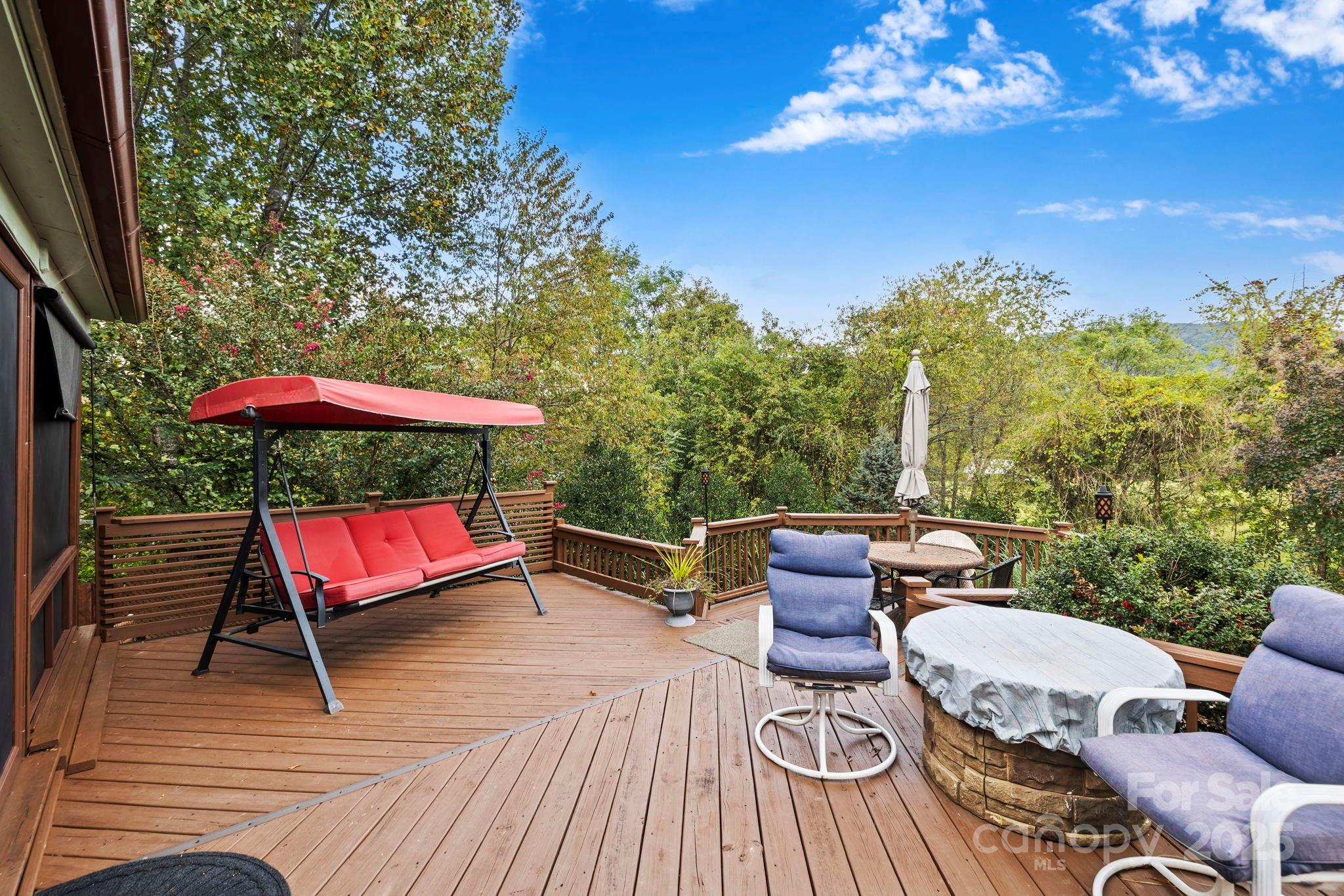 12 Timbers Edge Lane Fairview, NC 28730 - Photo 7 of 35 a sitting area with furniture and a garden