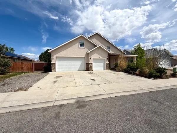 a house with trees in the background