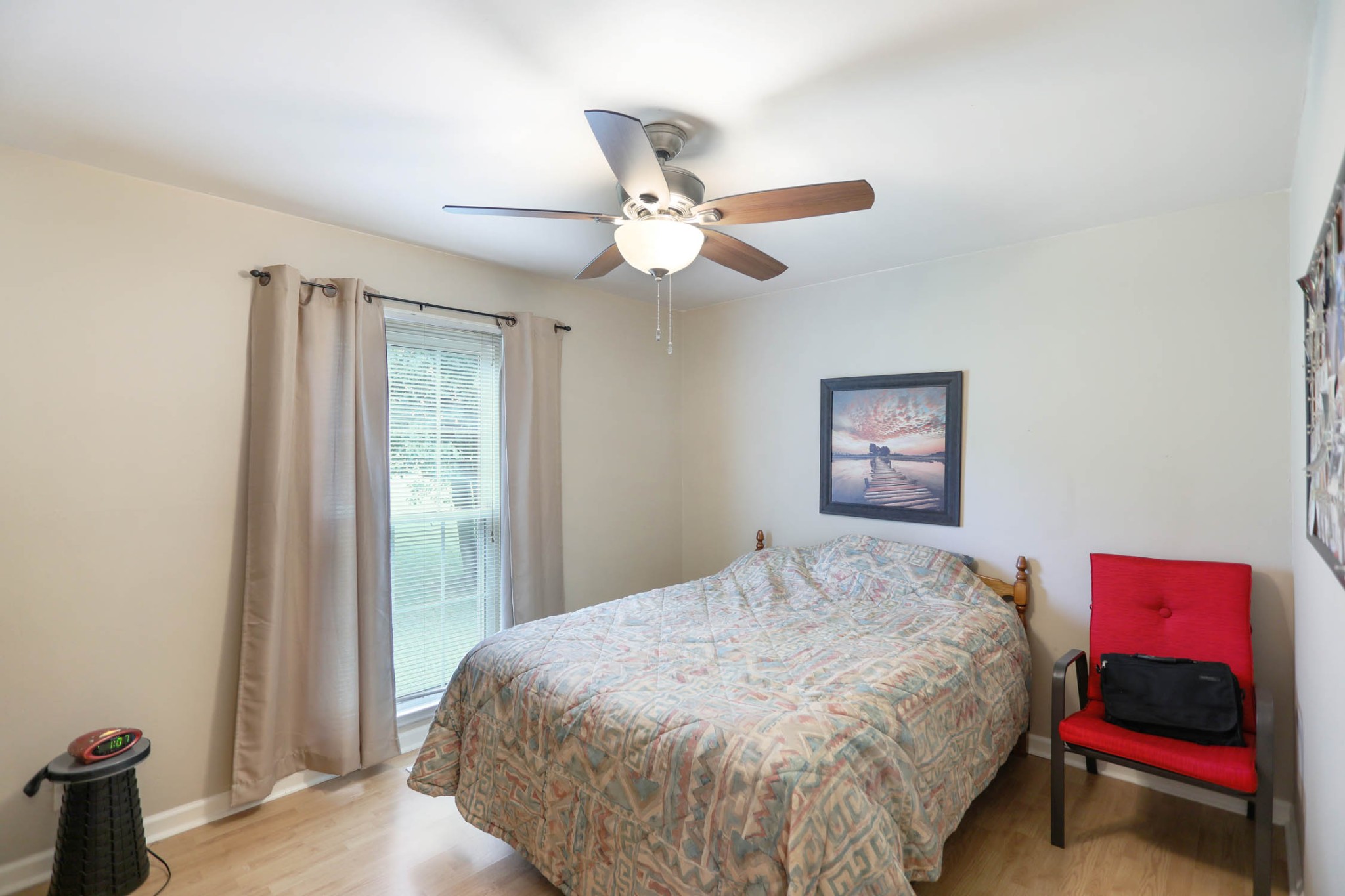 4971 Hyde Road Springfield, TN 37172 - Photo 15 of 36 a bedroom with a bed and a chandelier