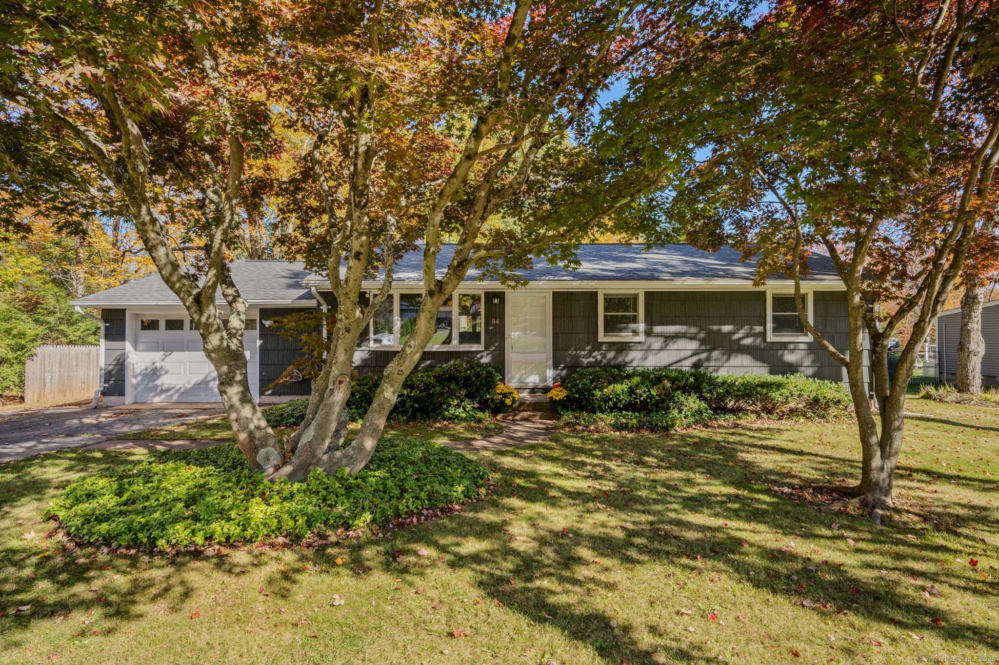 a view of a house with a yard