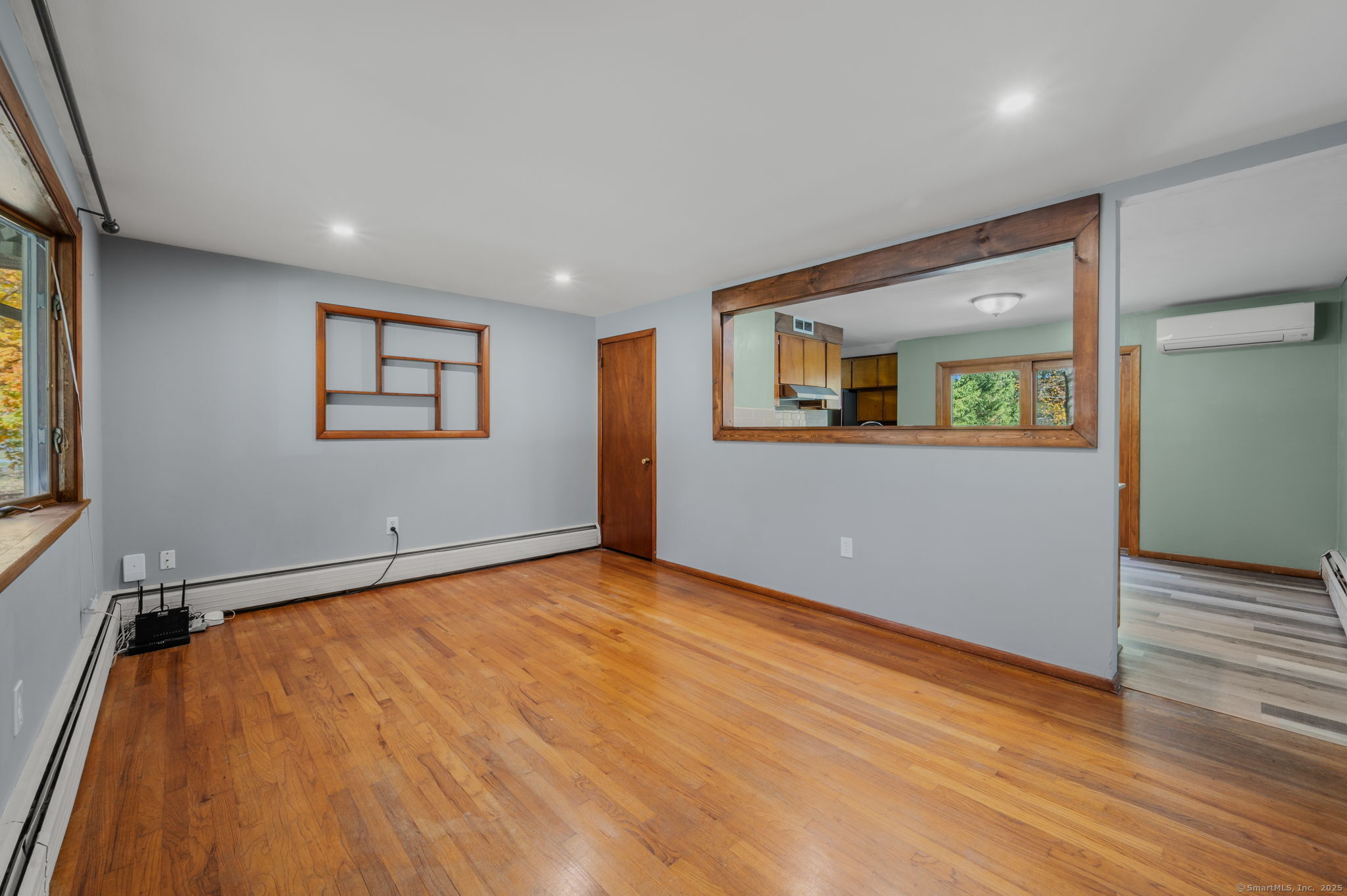 84 Camp Street Middletown, CT 06457 - Photo 4 of 36 a view of an empty room with wooden floor and a window