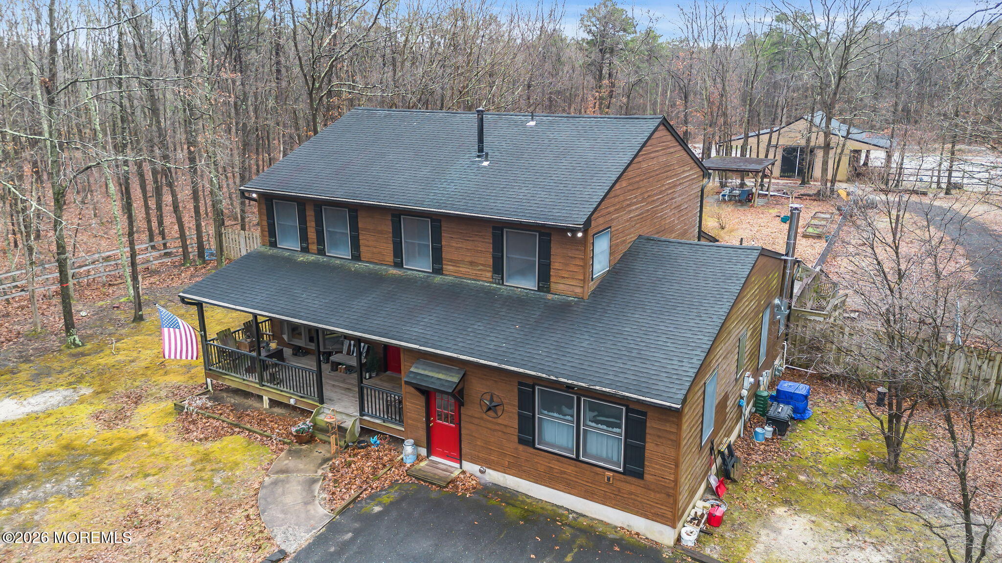 a aerial view of a house with a yard