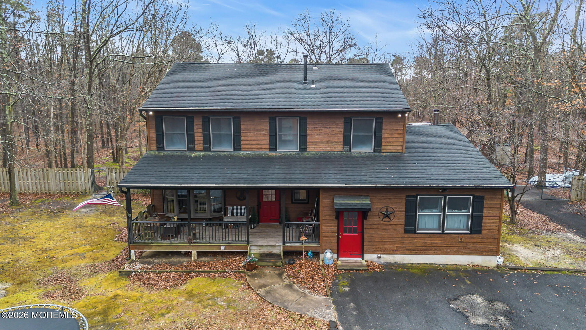 106 Vienna Road Howell, NJ 07731 - Photo 26 of 59 a front view of a house with a yard and seating space