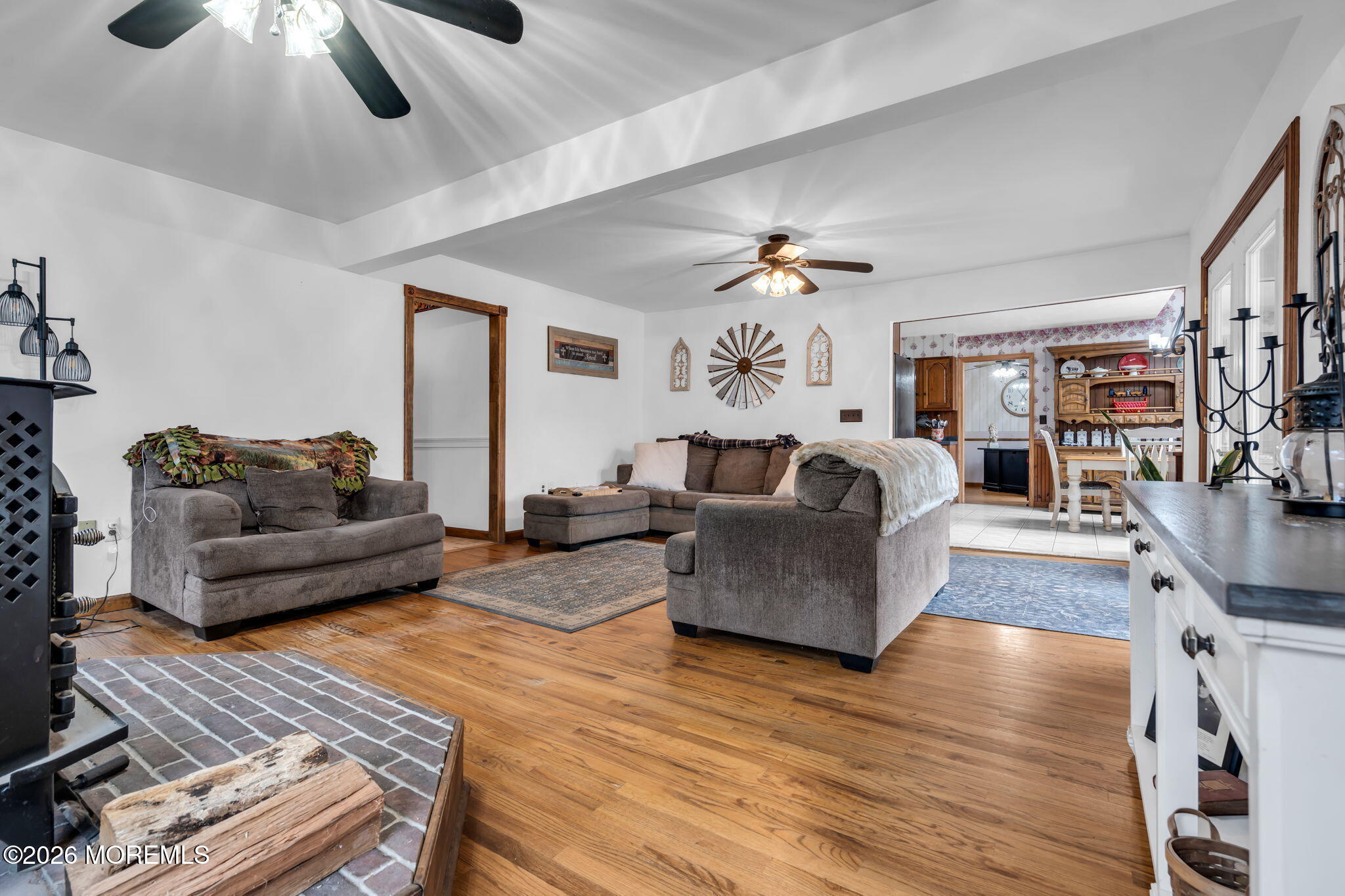 106 Vienna Road Howell, NJ 07731 - Photo 28 of 59 a living room with furniture and a wooden floor