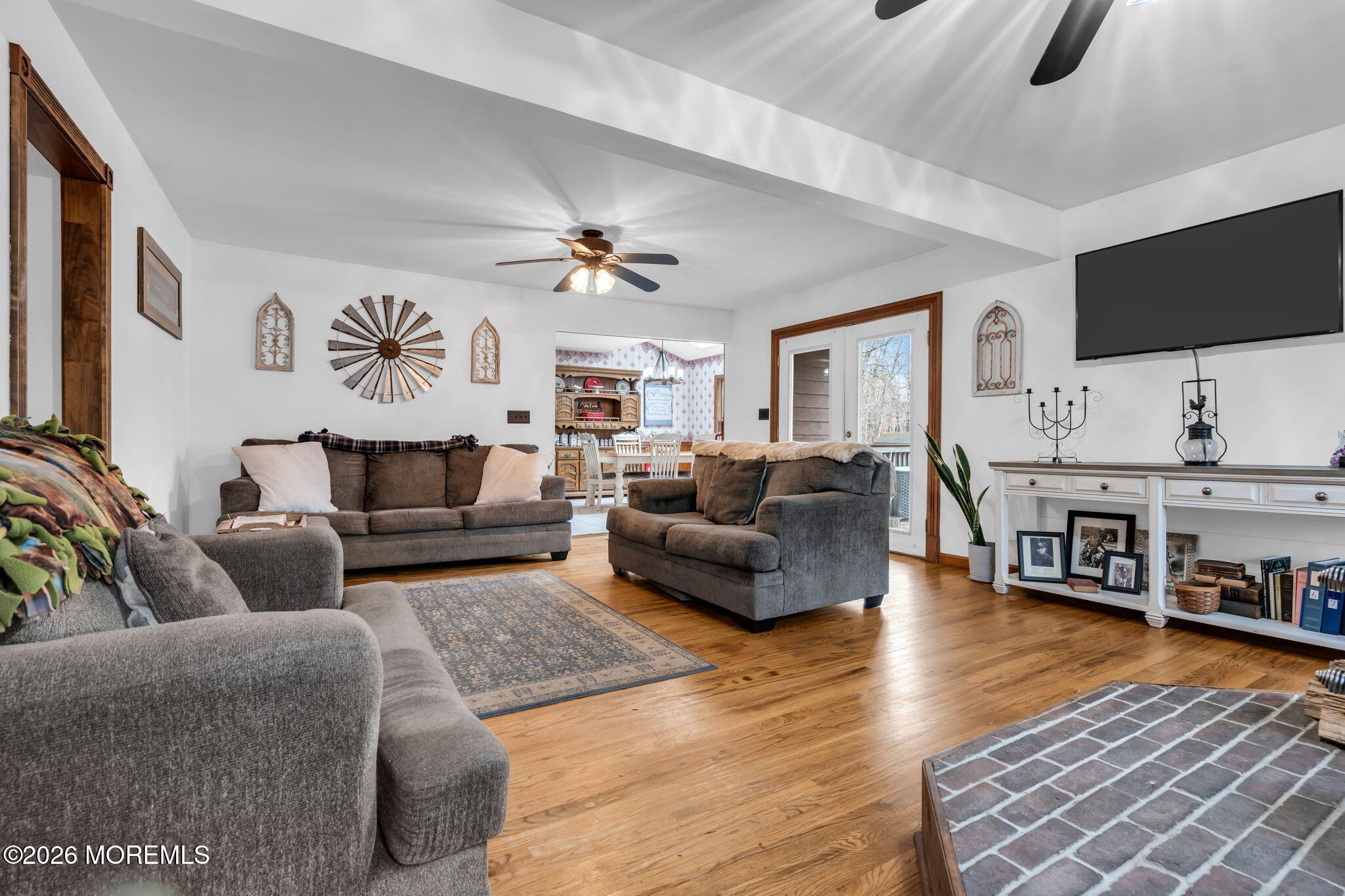 106 Vienna Road Howell, NJ 07731 - Photo 29 of 59 a living room with furniture and a flat screen tv