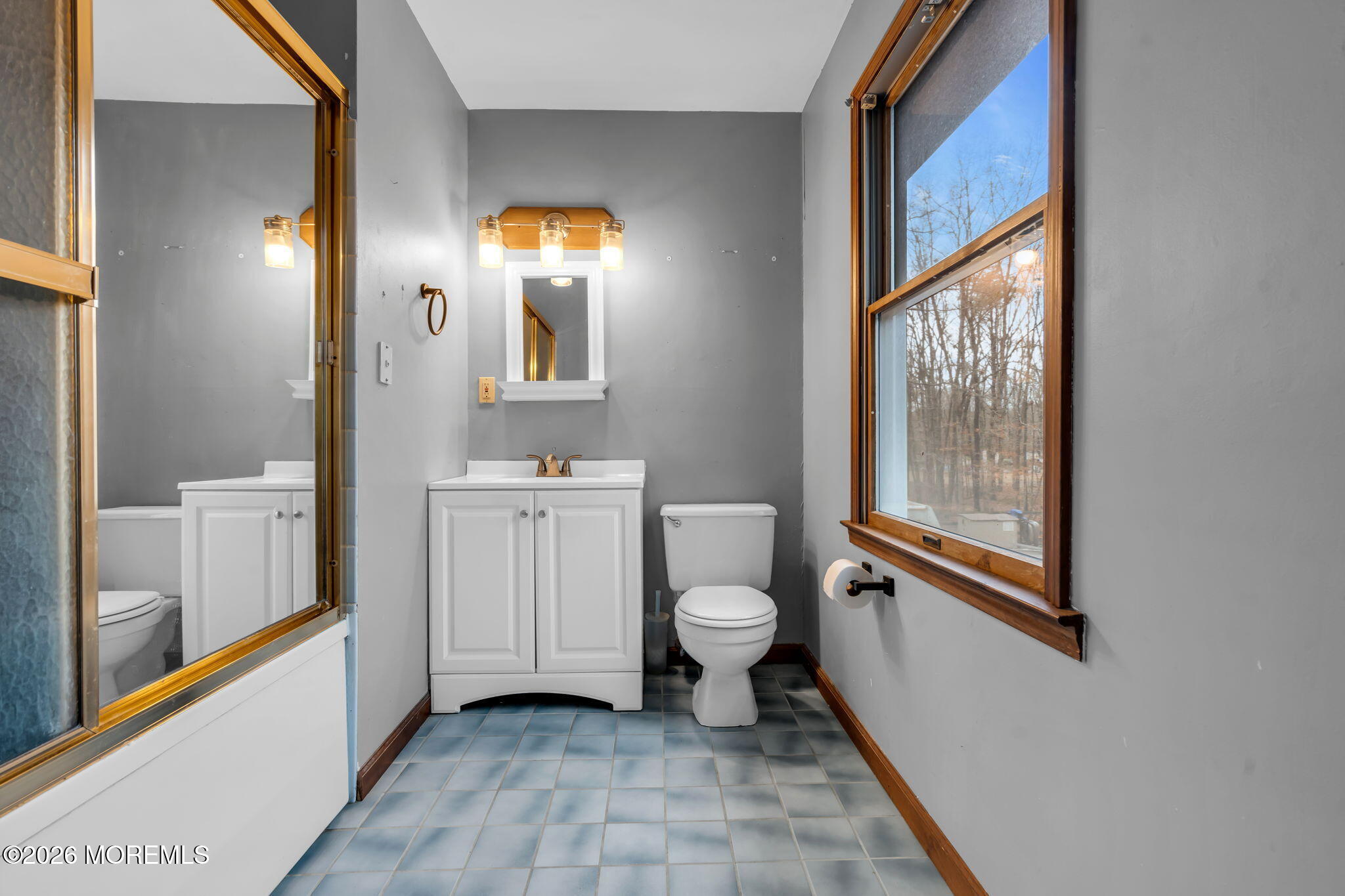 106 Vienna Road Howell, NJ 07731 - Photo 43 of 59 a bathroom with a toilet sink and mirror