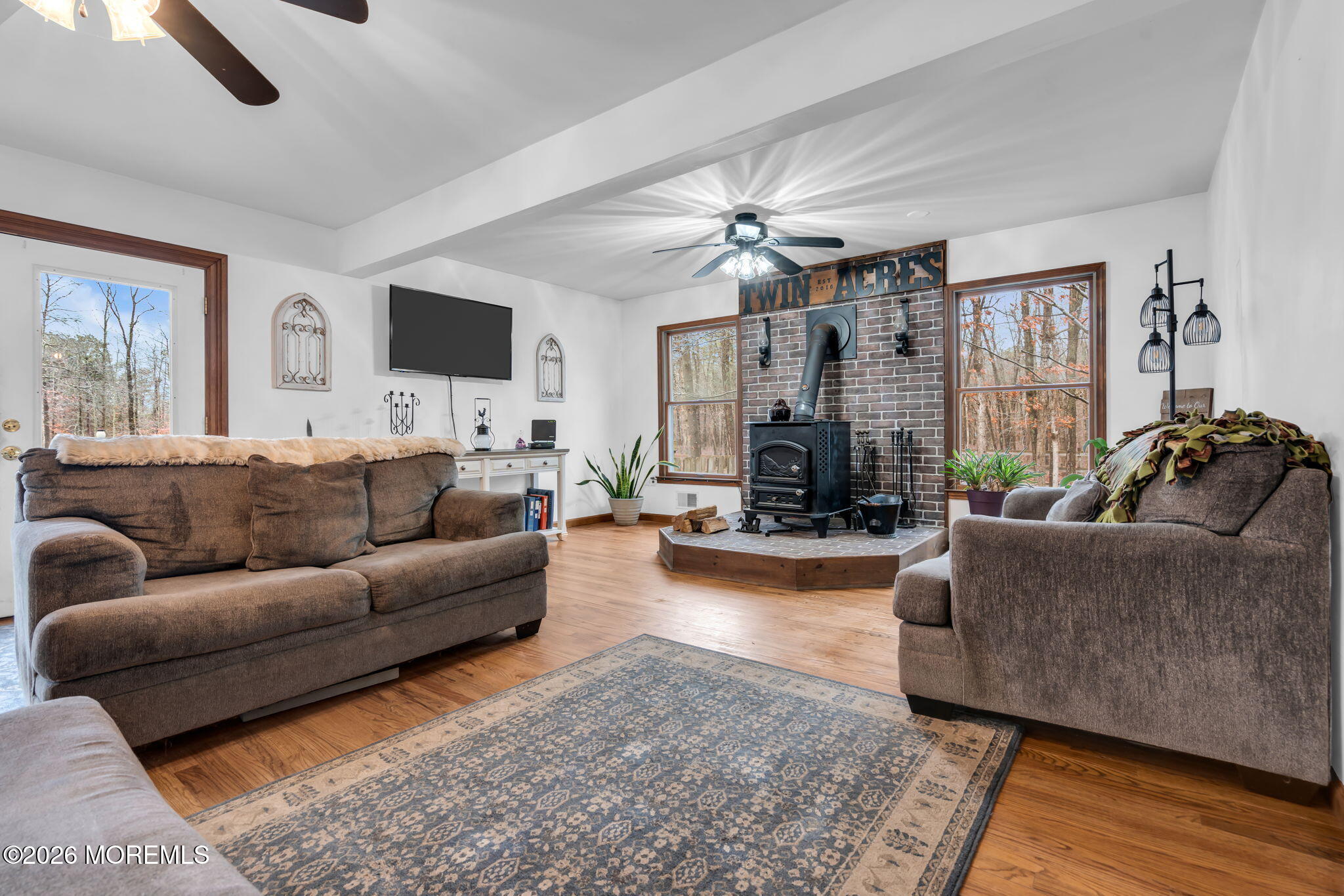 106 Vienna Road Howell, NJ 07731 - Photo 49 of 59 a living room with furniture and a flat screen tv