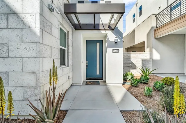 a view of a house with a potted plant