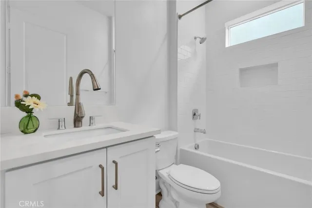 a bathroom with a sink a toilet and a bathtub