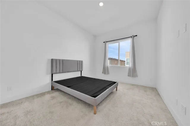 a living room with a couch and window