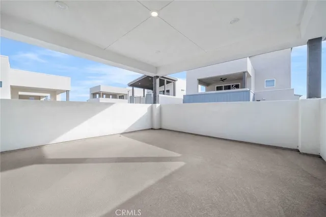 a view of a living room with furniture and window