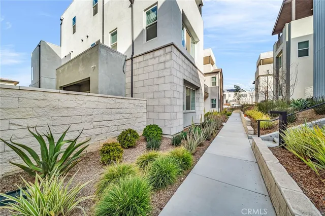 a view of a pathway both side house