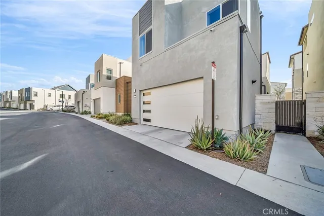 a view of a street with a cars parked in front of it
