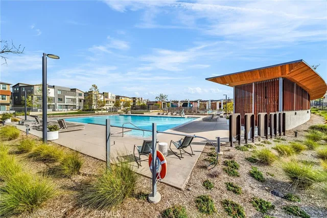 a view of a fountain with a big yard and plants
