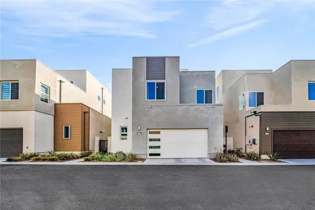 a front view of a building with a road
