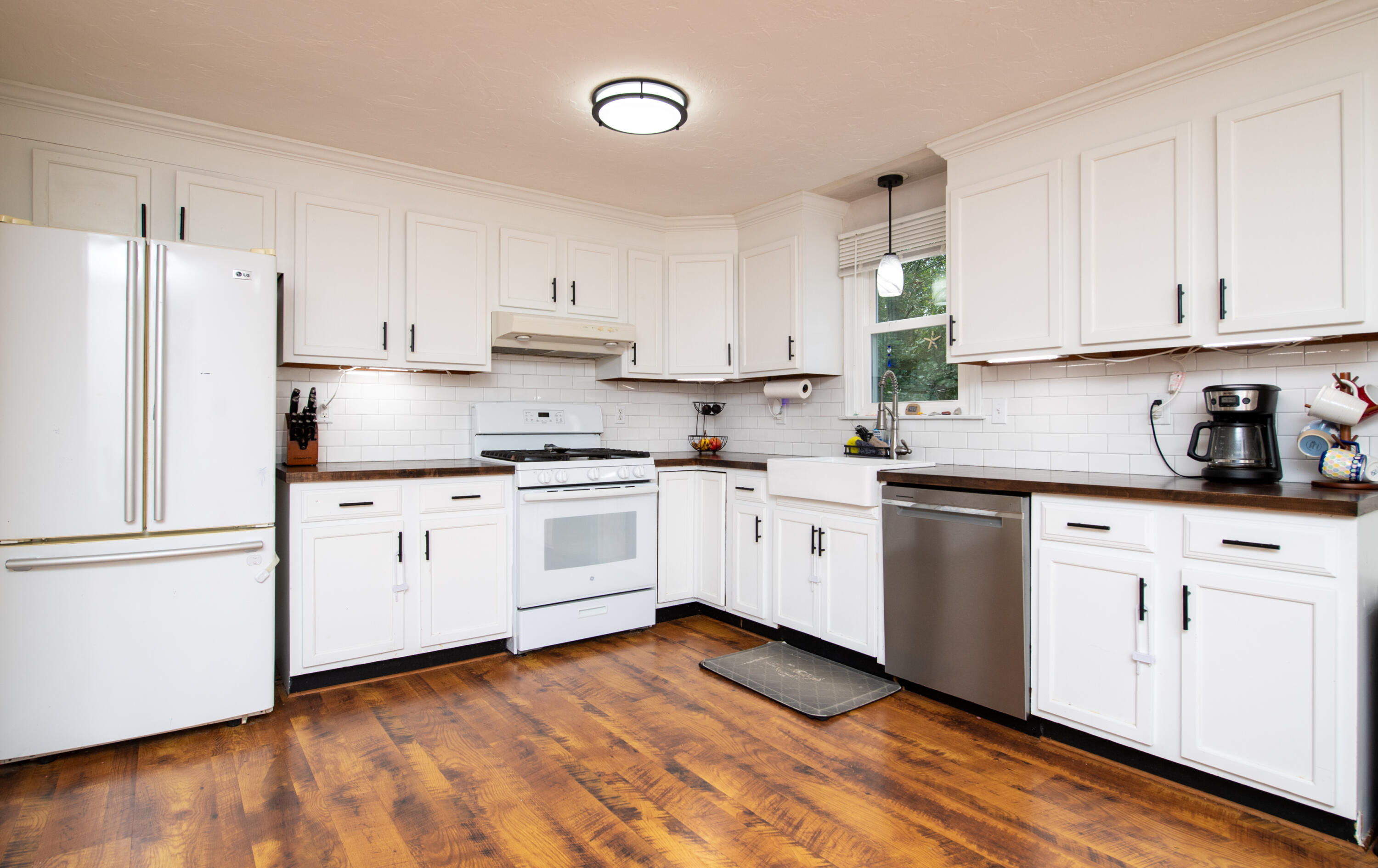 11 Warwick Way Mashpee, MA 02649 - Photo 15 of 67 a kitchen with granite countertop white cabinets and white appliances
