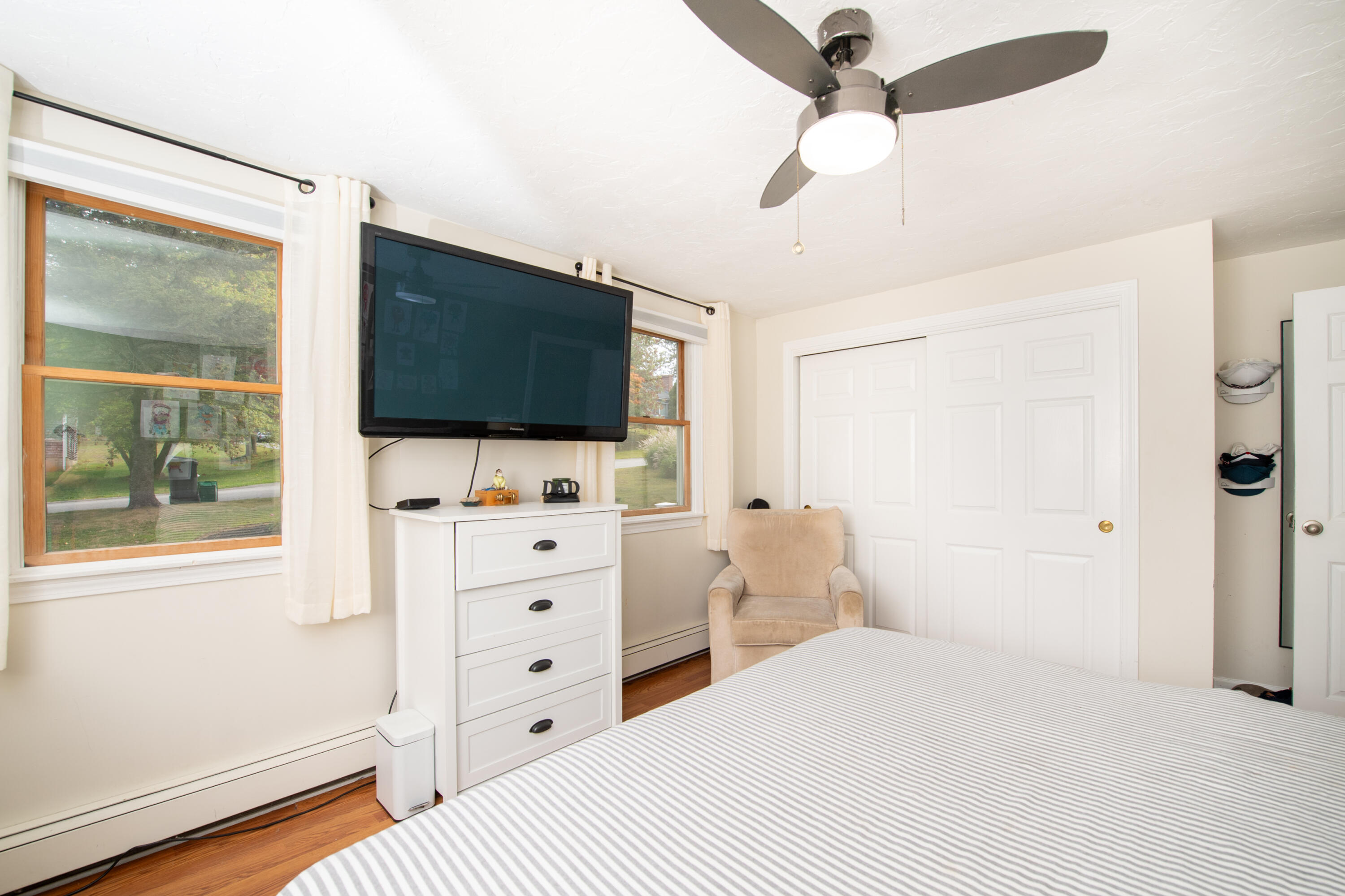 11 Warwick Way Mashpee, MA 02649 - Photo 22 of 67 a bedroom with a bed and a flat screen tv