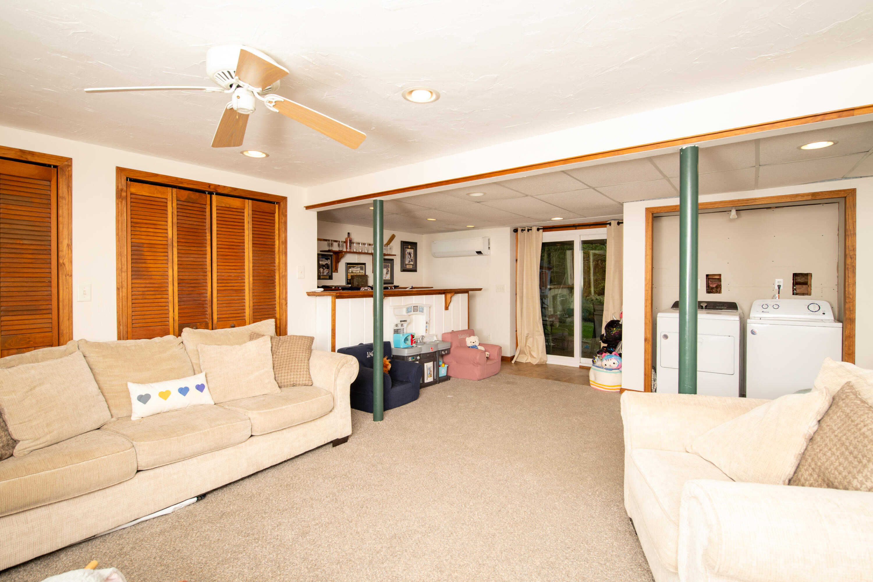 11 Warwick Way Mashpee, MA 02649 - Photo 28 of 67 a living room with furniture and large windows