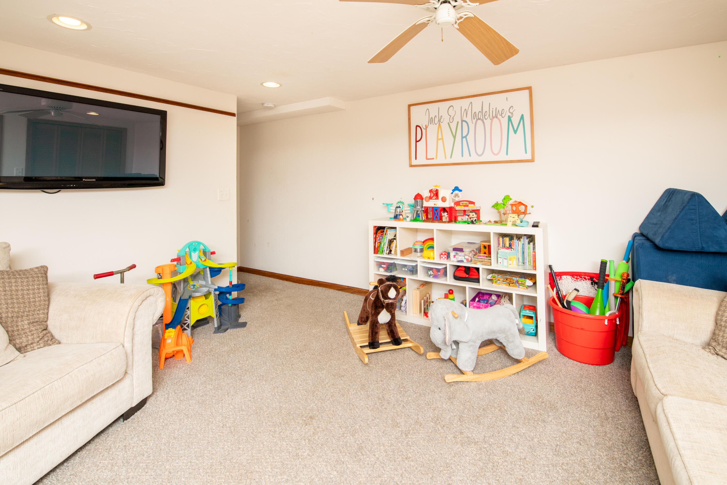 11 Warwick Way Mashpee, MA 02649 - Photo 30 of 67 a living room with baby toys and a flat screen tv
