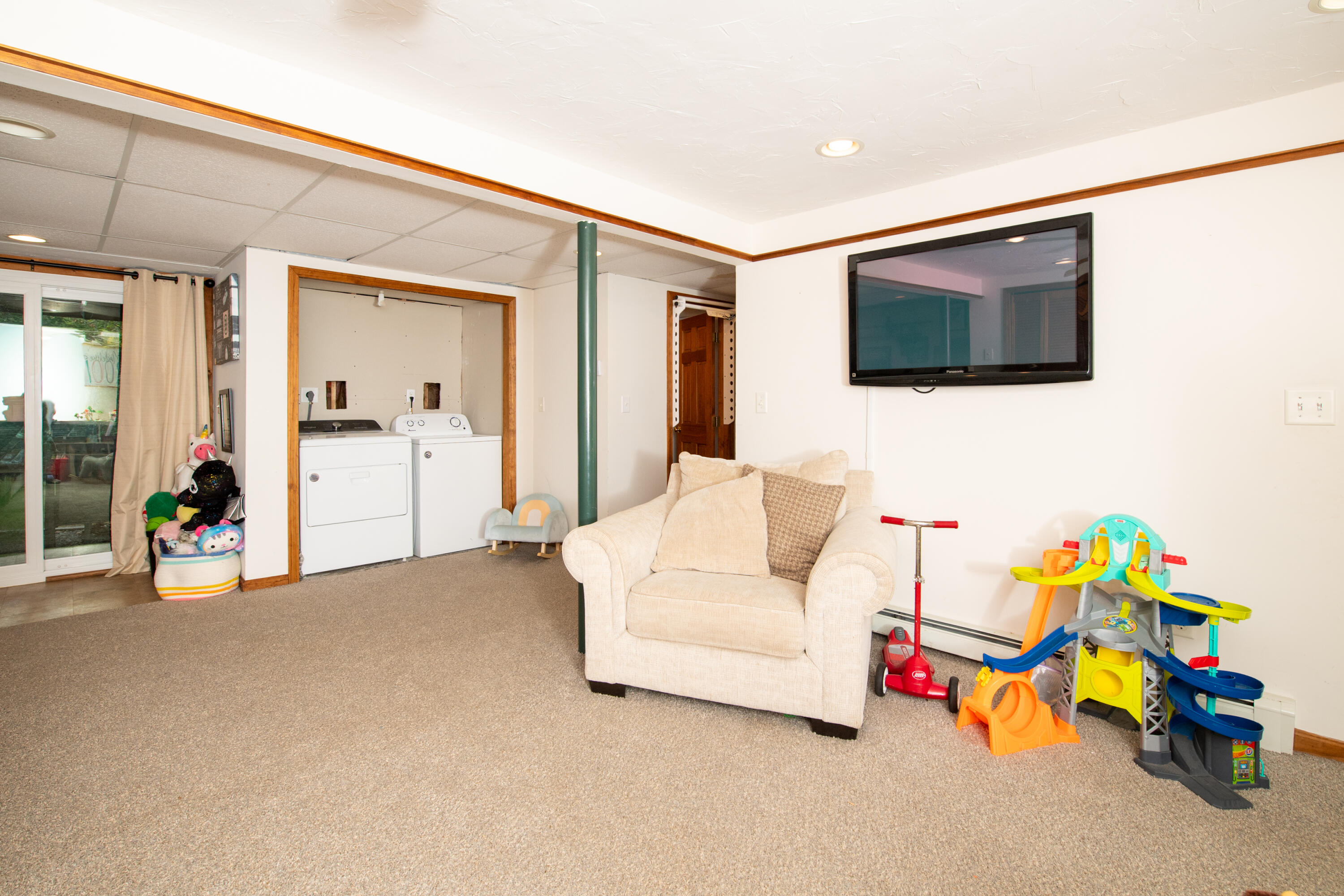 11 Warwick Way Mashpee, MA 02649 - Photo 31 of 67 a bedroom with furniture and a flat screen tv