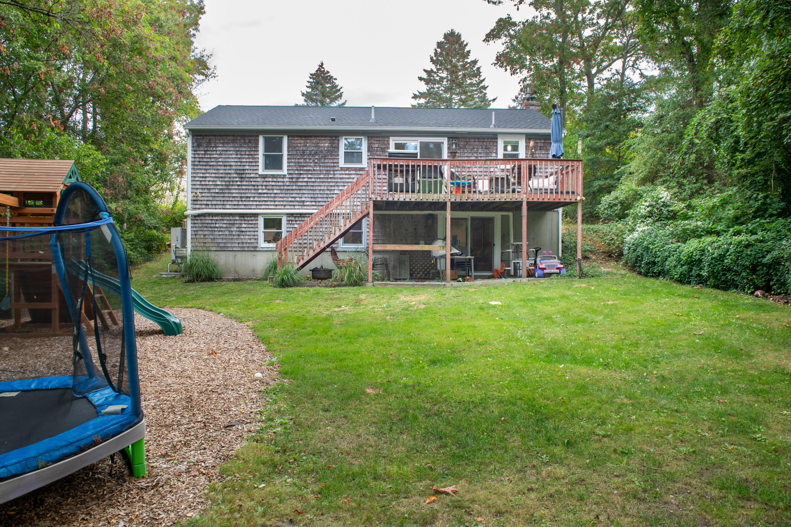 11 Warwick Way Mashpee, MA 02649 - Photo 44 of 67 a view of a house with a yard and sitting area