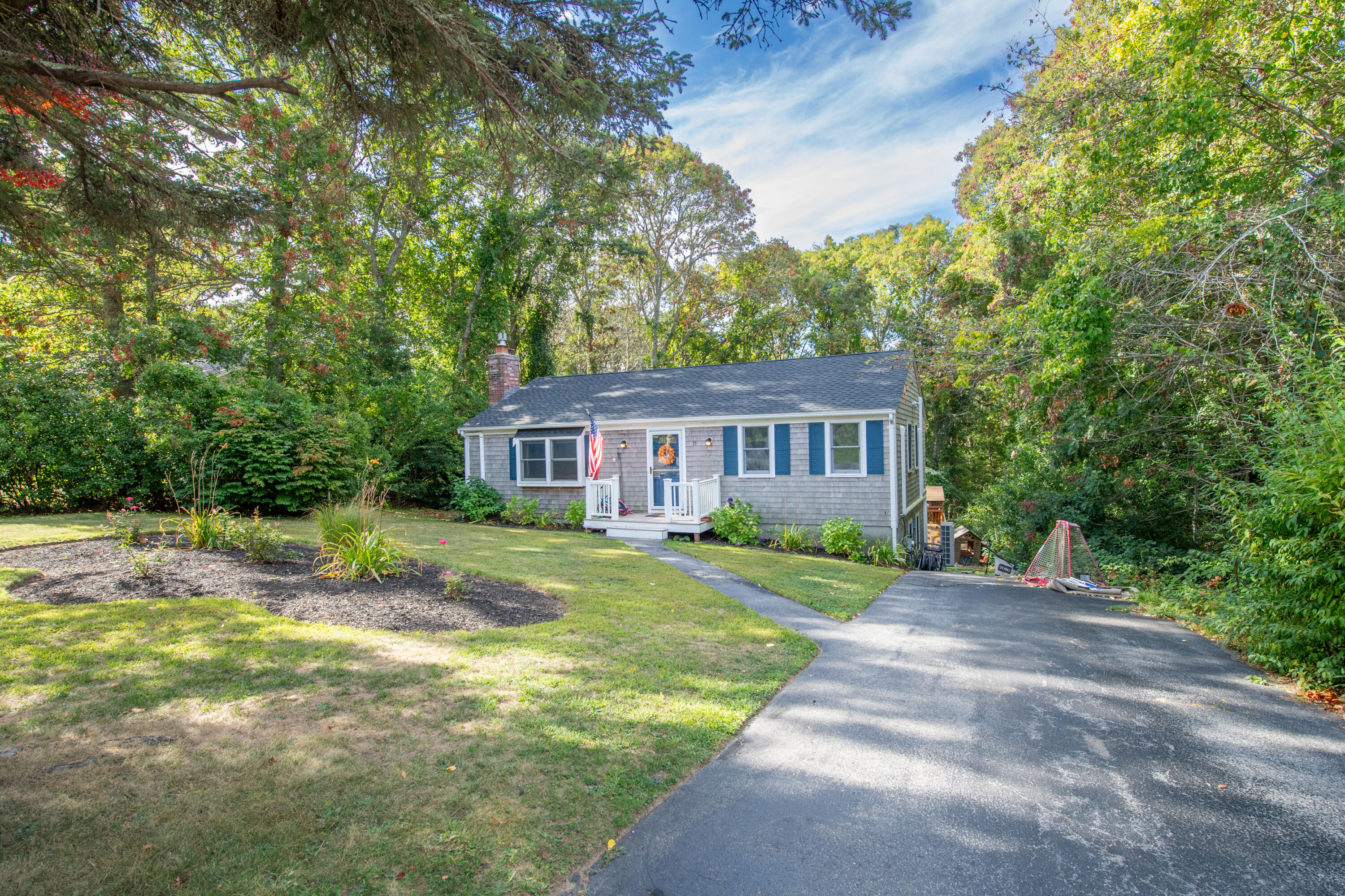 11 Warwick Way Mashpee, MA 02649 - Photo 49 of 67 a front view of a house with a yard