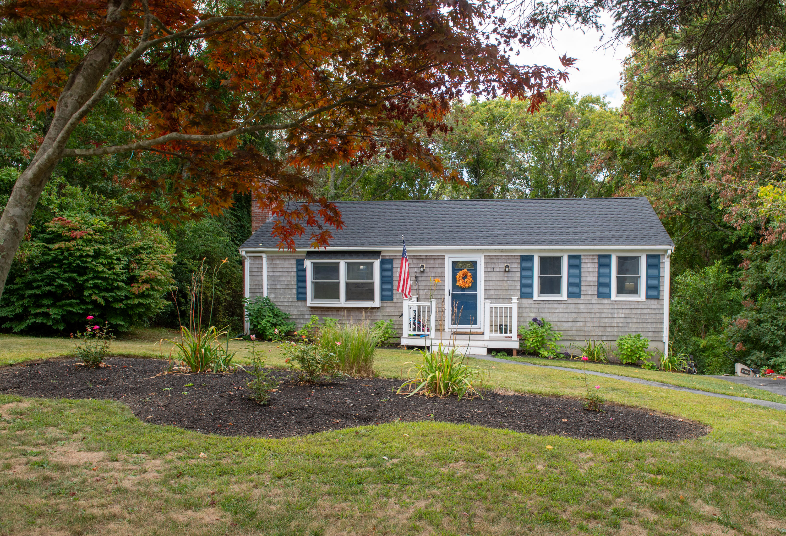 11 Warwick Way Mashpee, MA 02649 - Photo 59 of 67 a front view of a house with a yard