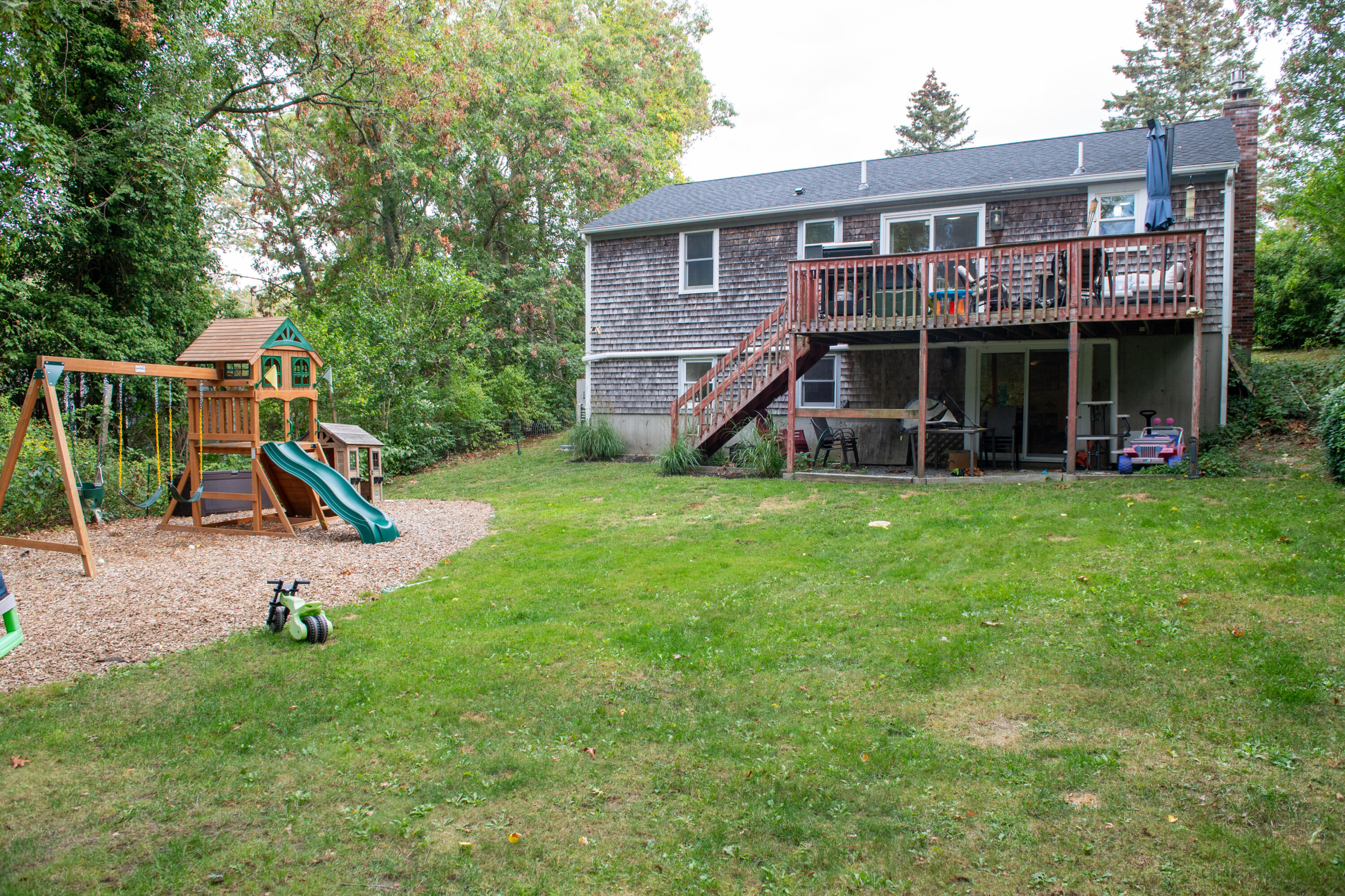 11 Warwick Way Mashpee, MA 02649 - Photo 63 of 67 a view of a house with a yard patio and a slide
