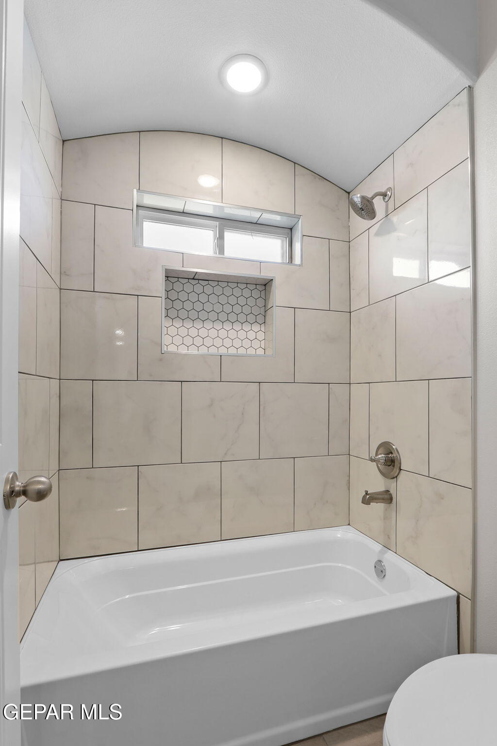 15213 Conviction Avenue El Paso, TX 79938 - Photo 34 of 41 a bathroom with a bathtub and a shower